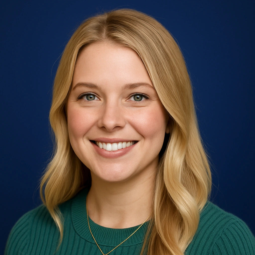 Professional headshot of Brooke Hensley, Project Manager at Authority Ink Press, smiling against a blue studio background.