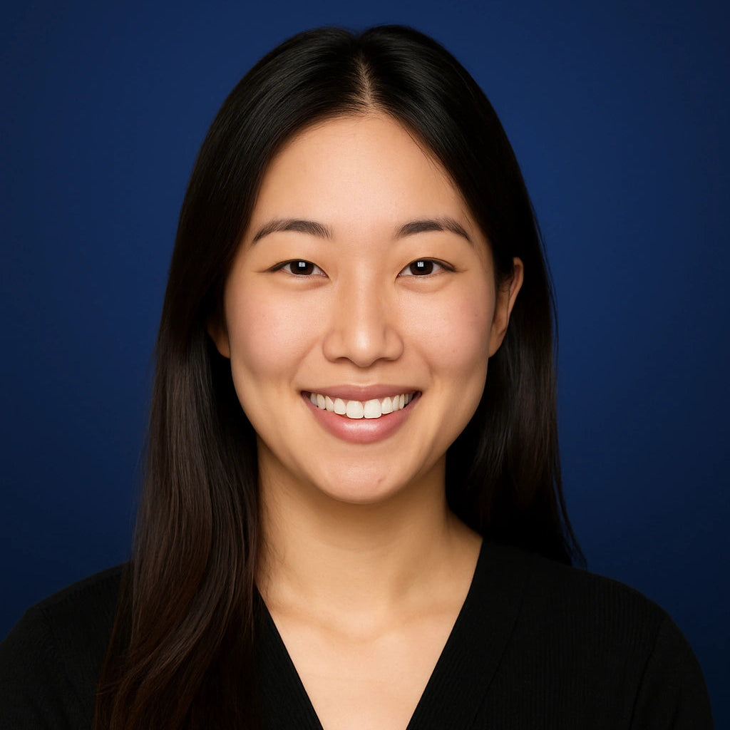 Professional headshot of Olivia Park, Project Manager at Authority Ink Press, smiling in front of a dark blue studio background.