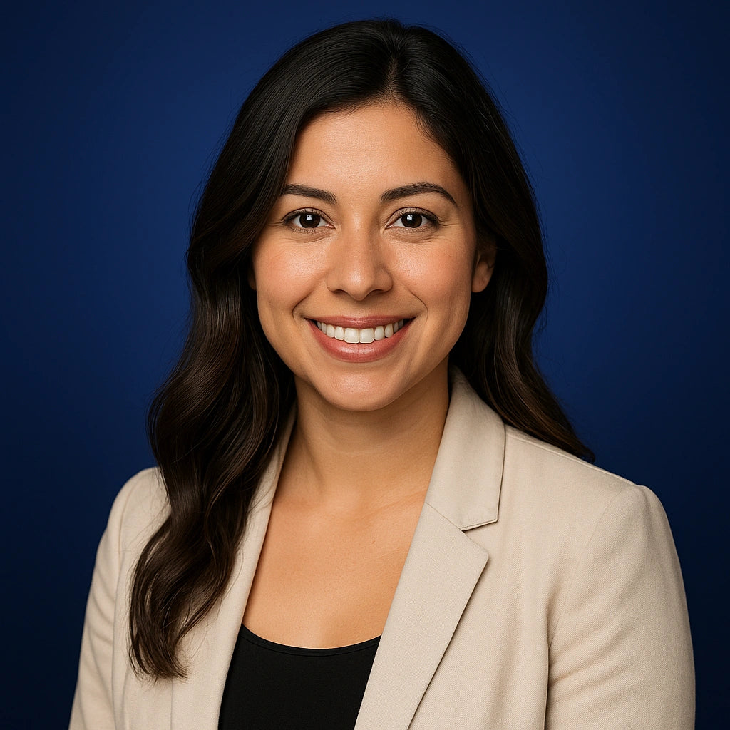 Professional headshot of Sofia Ramirez, Lead Writer at Authority Ink Press, smiling in front of a dark blue studio background.