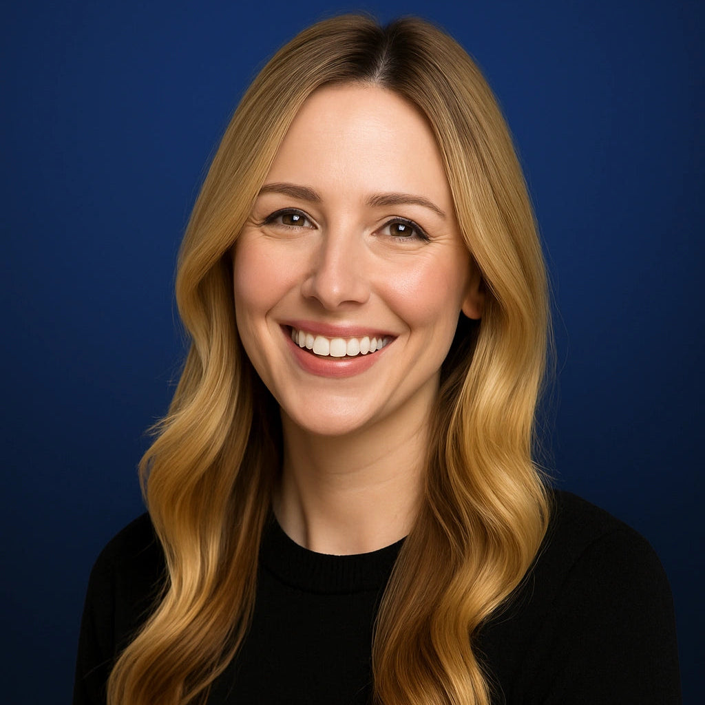 Professional headshot of Vanessa Murray, member of the Story Selection Team at Authority Ink Press, smiling in front of a dark blue studio background